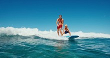 Father And Son Having Fun Surfing Together, Summer Lifestyle Family Time