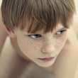 © Vladimir Serov/Blend Images - Close up of Caucasian boy's face
