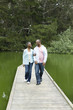 © Paul Simcock/Blend Images - Smiling African American couple standing on pier at lake