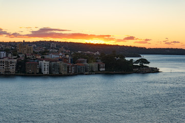 Wall Mural - Sun rising over Kirribilli suburb and Sydney Harbour. Urban morning landscape scene. Sydney, NSW, Australia