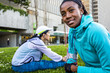 © Adam Hester/Blend Images - Runners stretching in urban park