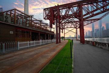 Empty road and iron tower with city landmark architecture backgr