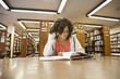 © Sam Bloomberg-Rissman/Blend Images - Mixed race girl studying in library