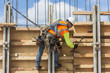 © Don Mason/Blend Images - Caucasian worker hammering wood at construction site