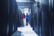 © Erik Isakson/Blend Images - Business people talking in server room
