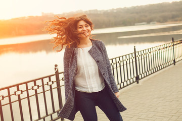 Happy overweight woman walking