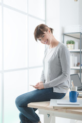 Poster - Young woman using a smart phone