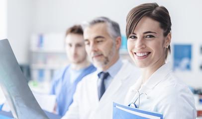 Wall Mural - Medical team examining an x-ray