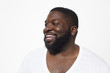 © Granger Wootz/Blend Images - Close up of smiling Black man with beard