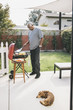 © Hello Lovely/Blend Images - African American man grilling in backyard