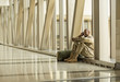 © Mark Edward Atkinson/Tracey Lee/Blend Images - African American soldier talking on cell phone in airport