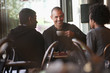© Mark Edward Atkinson/Tracey Lee/Blend Images - Friends sitting together in cafe
