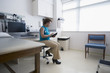 © John Fedele/Blend Images - African American doctor using digital tablet