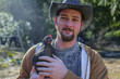 © Eric Raptosh Photography/Blend Images - Caucasian farmer holding chicken