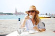 Enjoy sightseeing in the old town. Mature woman on vacation in Venice.