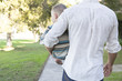 © Sam Diephuis/Blend Images - Caucasian father carrying son on sidewalk