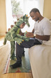© Hello Lovely/Blend Images - Girl in dragon costume playing with father