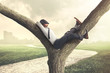 Lazy business man enjoying break on a tree