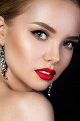 Wall Mural - Close up portrait of young beautiful woman with red lips