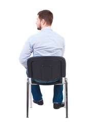 back view of business man sitting on chair.  businessman watching. Rear view people collection.  backside view of person.  Isolated over white background. Bearded businessman in white shirt sits on a