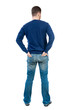 © ghoststone - back view of Business man  looks.  Rear view people collection.  backside view of person.  Isolated over white background. bearded man in blue pullover standing with his hands in the back pockets of