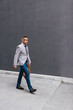 © SokRom - Shot of a stylish mature man crossing a city street. On the way to business meeting