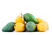 A Pile Yellow Ripe Mango And Fresh Green Mango  On White Background Healthy Fruit Food Isolated
