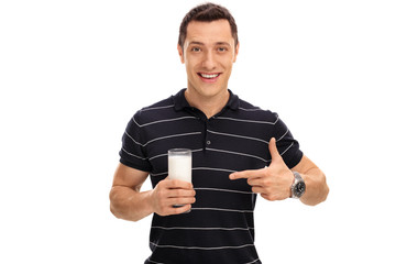 Wall Mural - Man holding a glass of milk