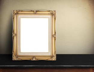 Wall Mural - Blank Gold victorian picture frame on black marble table at yell