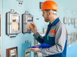 © GVS - young engineer taking notes at control room