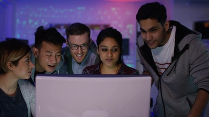 Wall Mural -  Team of young computer hackers trying to gain access to a computer system