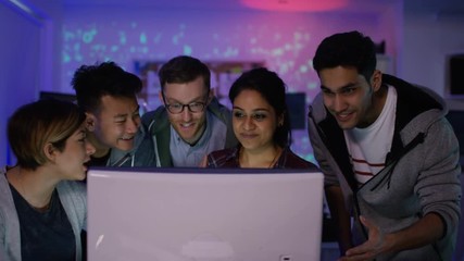 Wall Mural -  Team of young computer hackers trying to gain access to a computer system