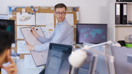 Wall Mural -  Young creative technical design team working in office with lots of computers