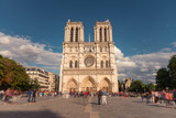 Fototapeta Paryż - Notre Dame de Paris. France. Ancient catholic cathedral on the quay of a river Seine. Famous touristic architecture landmark in summer
