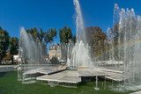 Fototapeta Tęcza - Panoramic view of Fountain and rainbow in the center of City of Pleven, Bulgaria