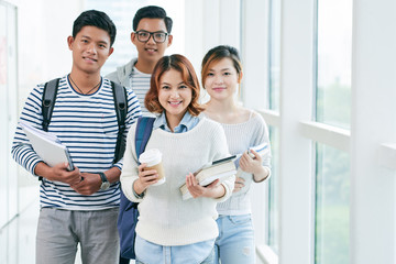 Wall Mural - Group of Vietnamese students standing in university corridor