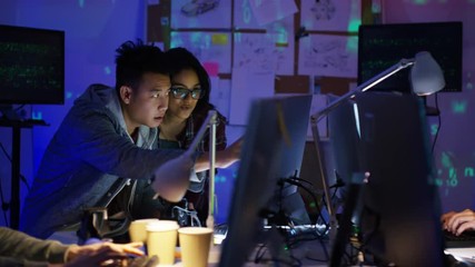 Wall Mural -  Team of young computer hackers trying to gain access to a computer system