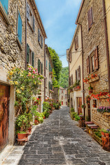  Narrow paved street in the old town in Italy