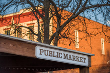 Public Market Sign On Western Building With Bare Tree