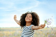 © Africa Studio - Happy little African American girl in the field
