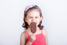 Young Girl Feeling Happy While Eating Chocolate Ice Cream Bar