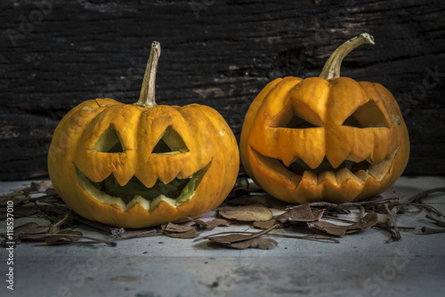 Halloween pumpkins on grungy wooden background