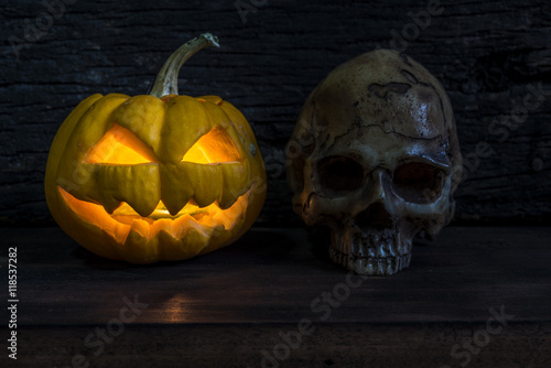 Halloween pumpkin head jack lantern with human skull
