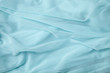 A full page close up of soft blue chiffon material texture