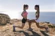 © Westend61 - Spain, Asturias, two sportswomen training on the coast