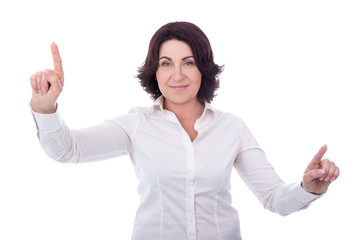 Wall Mural - mature business woman pressing imaginary buttons isolated on whi