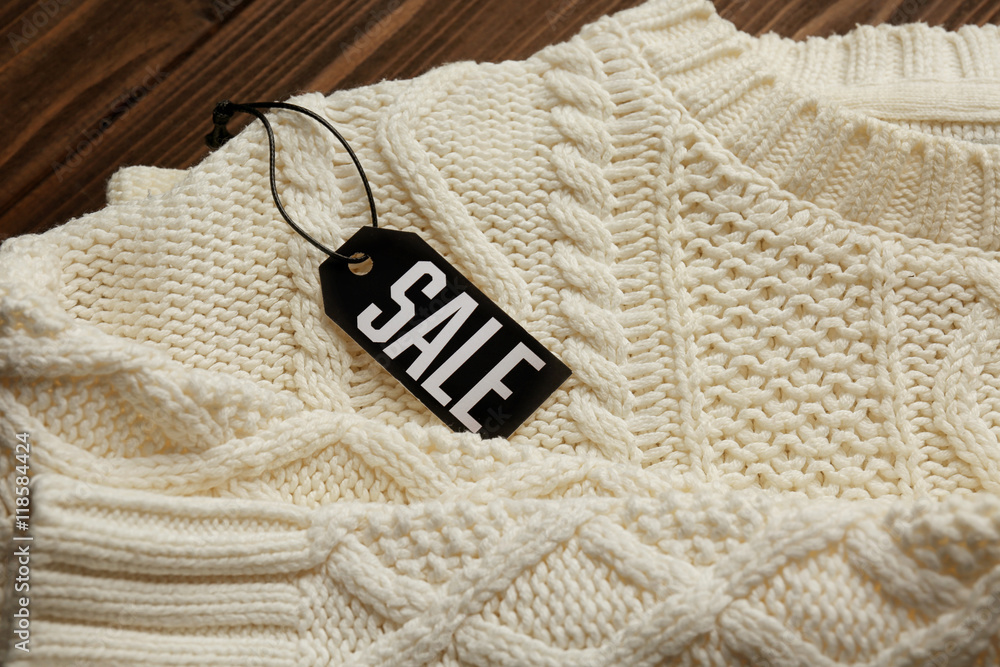 Sale label on sweater, closeup