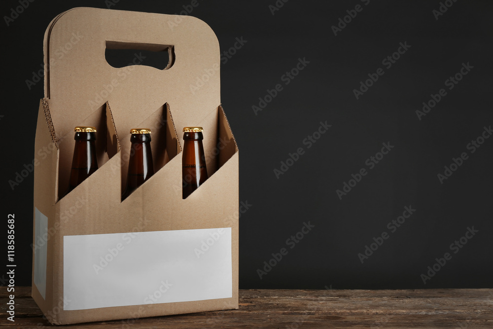 Paper beer package on black background