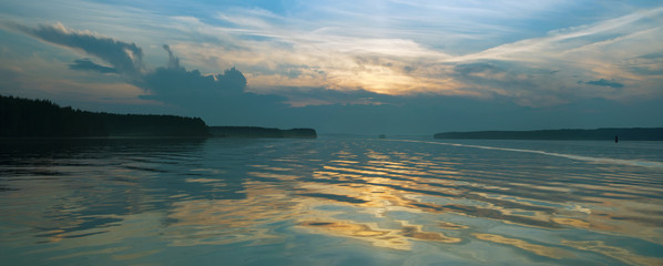 Wall Mural - landscape setting sun on the background of the river.
