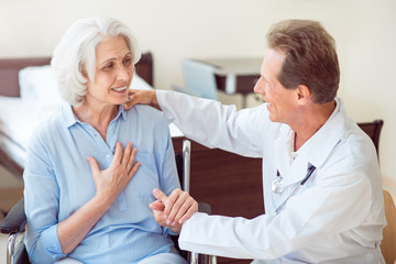 doctor talking with old patient